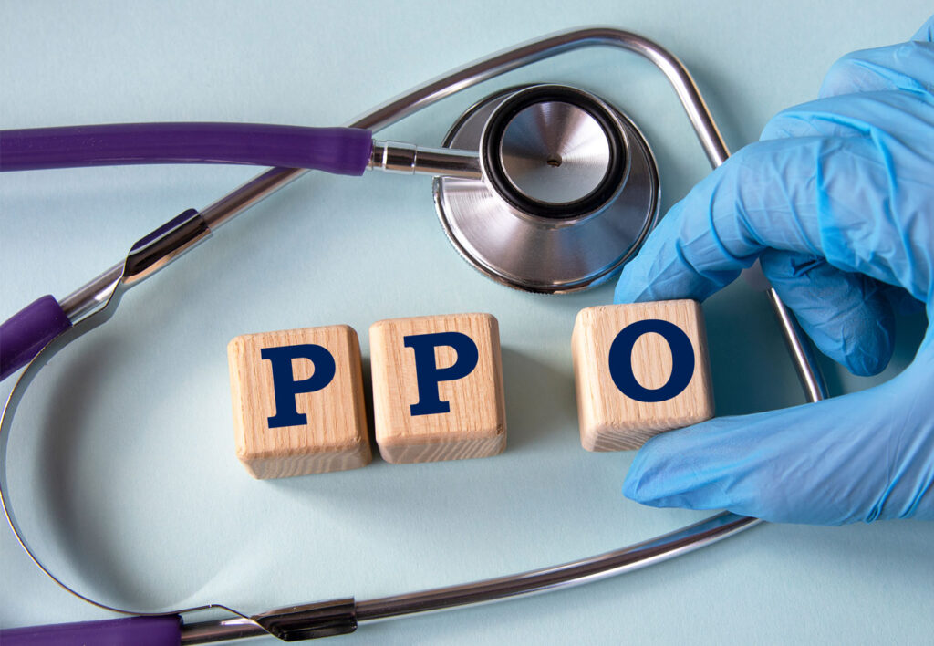 PPO on wooden blocks with a Stethoscope in the background. Doctor holding the PPO block